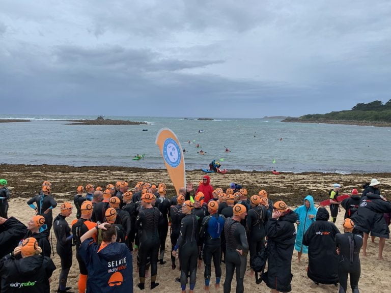 People gather at the beginning of the swim
