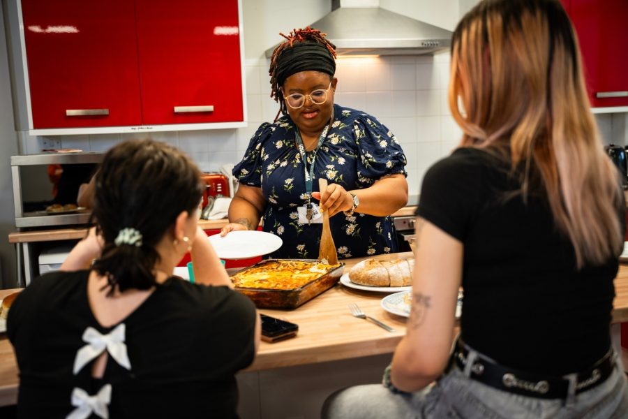 Volunteer chaplain cooking food young people -work for us