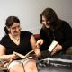 tenant satisfaction featured image. two girls sat on a bed reading together