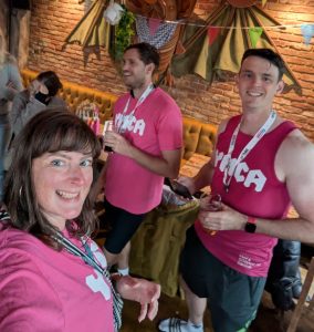 people in YMCA vests and London to Brighton cycle ride medals