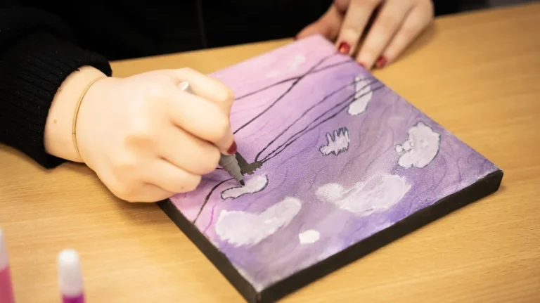 close shot on hand painting, artwork visible