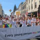 YMCA DownsLink group marching at Brighton Pride 2026, behind a banner reading 'Every young person matters'