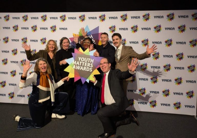 Chaplaincy nominees on stage holding a Youth Matter Awards sign