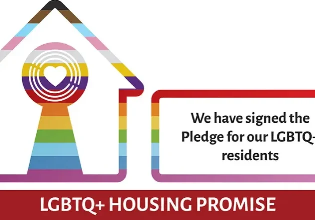 Logo of LGBTQ+ Housing Pioneer+ featuring a house with rainbow colours and text stating, "We are going further alongside our LGBTQ+ residents.”