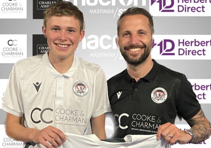 Tom Hearn player with coach for banner