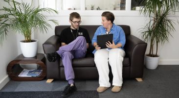 Young man and support worker - values