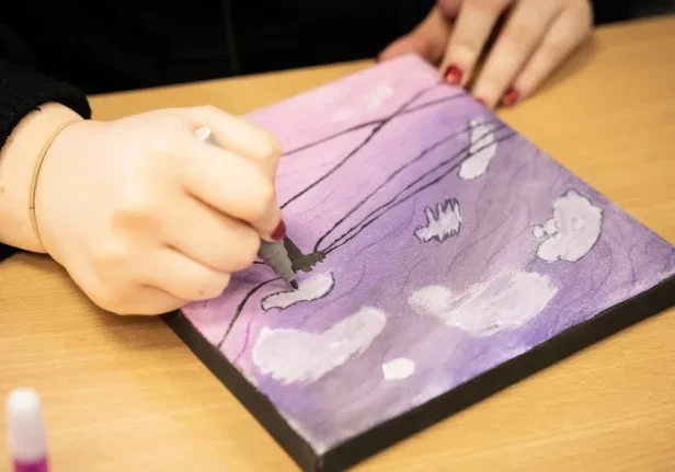 close shot on hand painting, artwork visible